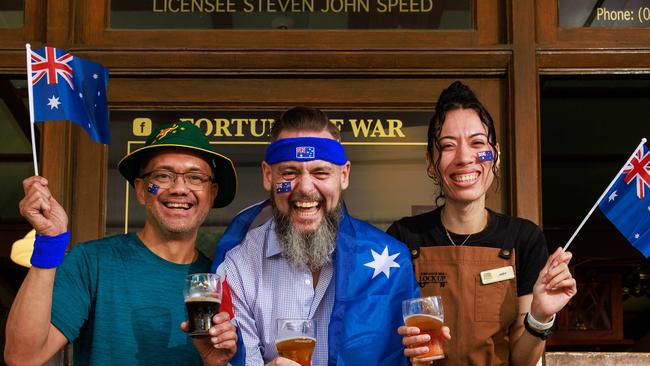 Patrons Tommy Slatter, Neil Jones and Judy Chute will be toasting January 26 at the Fortune of War, The Rocks. Picture: Justin Lloyd.