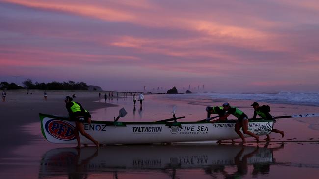 Surf boats return after performing a burial at sea for Anzac Day on April 25, 2024 in Currumbin, Australia. (Photo by Chris Hyde/Getty Images)