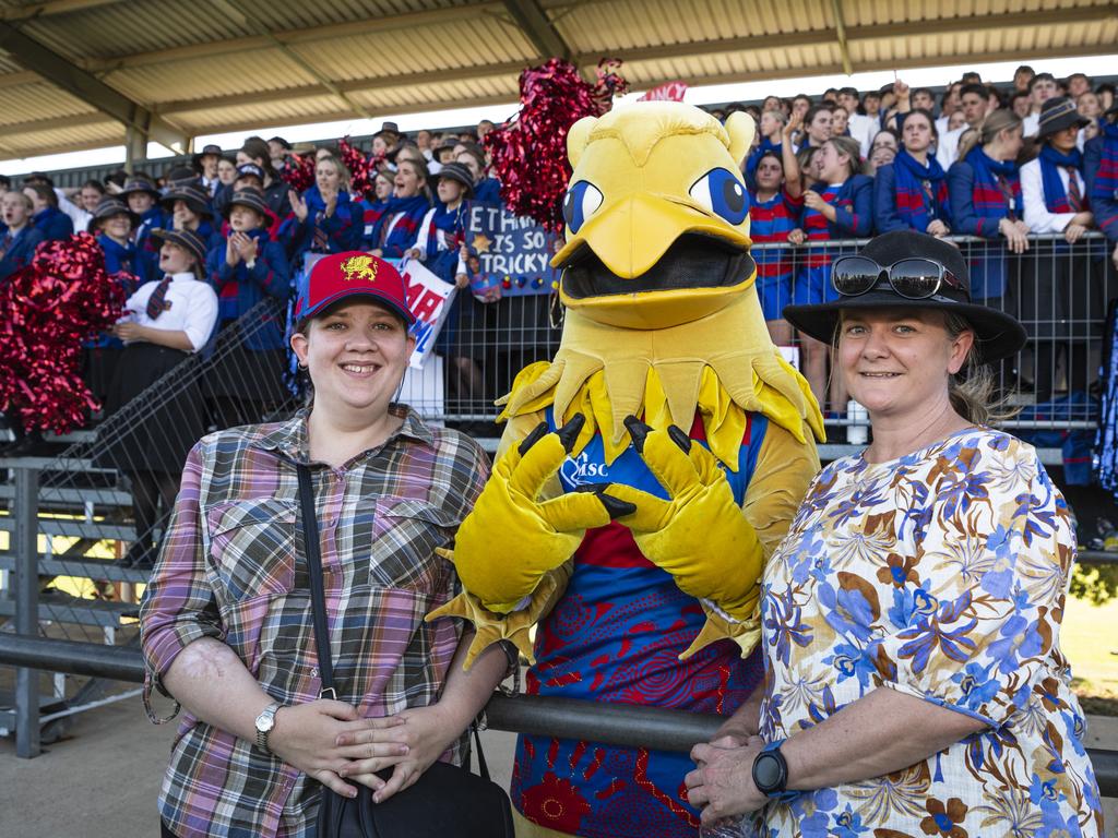 Emma Durack (left) and Leanne Colthup with the Downlands Griffin (Patrick McCarthy-Cole) in front of the Downlands supporters stand. Picture: Kevin Farmer