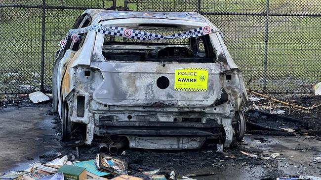 A stolen car burnt out on Warrego Way in Helensvale. Picture: Keith Woods.