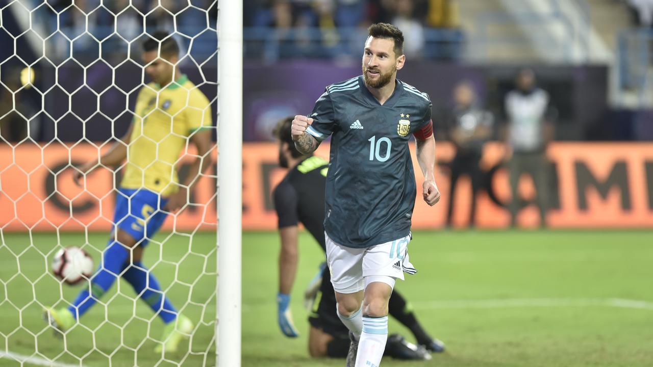 Messi returns from a three-month international ban to secure the win for Argentina over Brazil.
