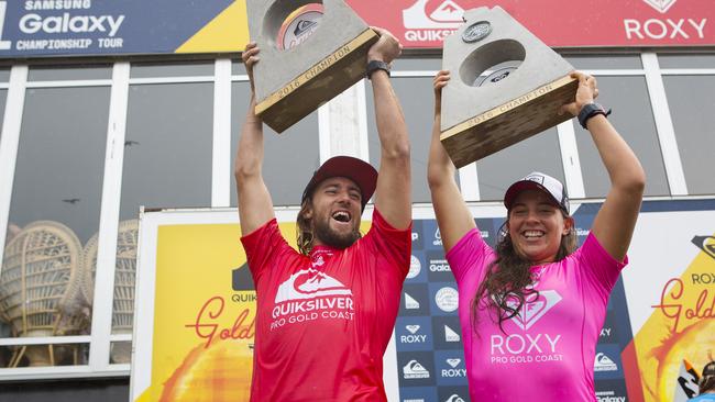 Matt Wilkinson and Tyler Wright celebrate their wins at the Quiksilver and Roxy Pros.