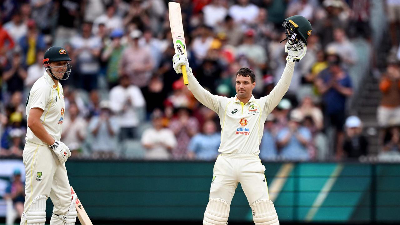 Carey celebrates his maiden Test ton on Day 3 at the MCG. (Photo by William WEST / AFP)