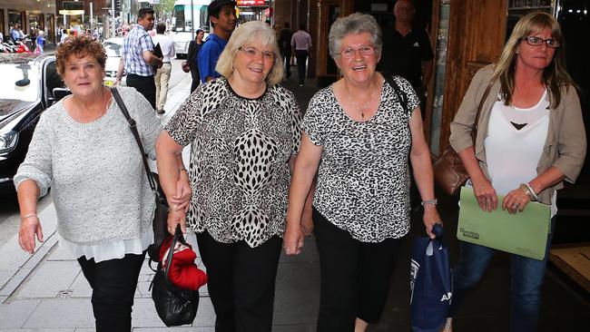 Witnesses ... Melbourne-based Chiquita mushroom pickers leave the royal commission after giving evidence. Picture: John Feder