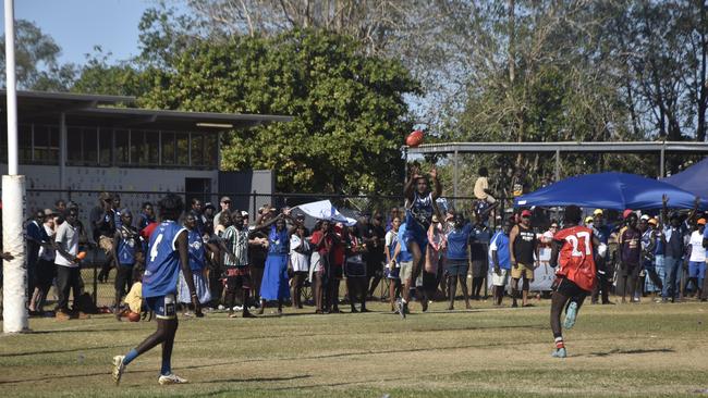 A Buffaloes player takes a mark in defence just before the final siren in the Tiwi Island Football League grand final between Tuyu Buffaloes and Pumarali Thunder. Picture: Max Hatzoglou