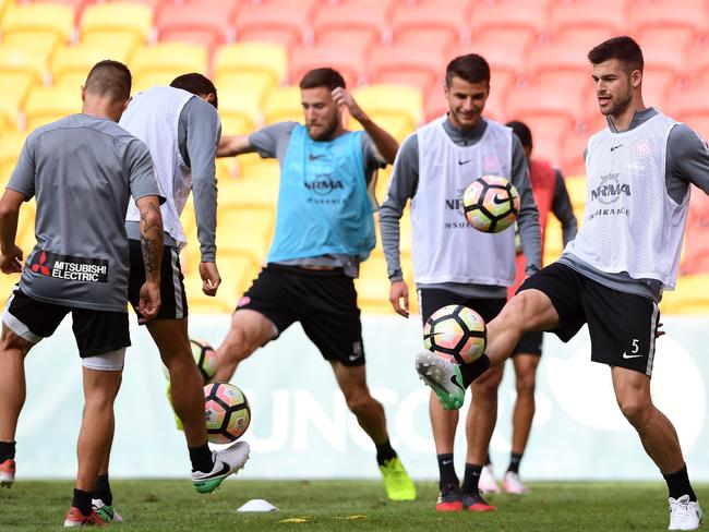 Brendan Hamill (right) during the Western Sydney Wanderers training session in Brisbane, Thursday, April 20, 2017. The Wanderers play the Brisbane Roar in a preliminary final match in Brisbane, Friday. (AAP Image/Dave Hunt) NO ARCHIVING