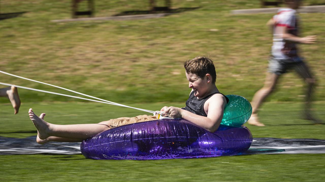 Flynn Gibson having fun on the slip and slide as Toowoomba Grammar School hosts the Sony Foundation Children’s Holiday Camp, Monday, September 16, 2024. Picture: Kevin Farmer