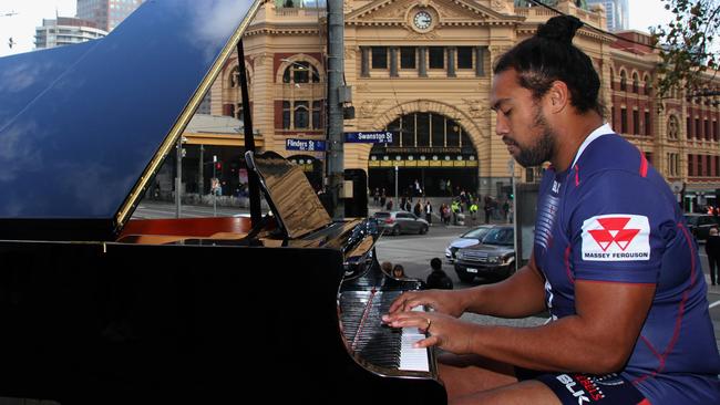 Melbourne Rebels prop Fereti Sa'aga serenades the streets of Melbourne on a grand piano.