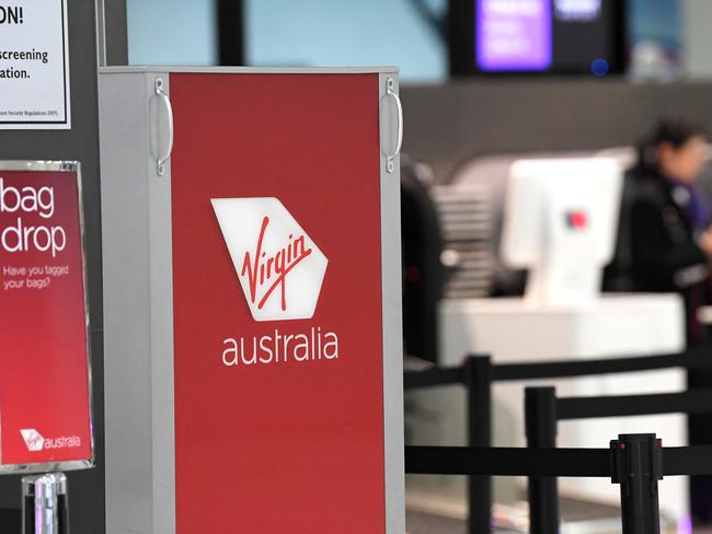 Signage for Virgin Australia is seen at Melbourne Airport in Melbourne, Monday, April 20, 2020. (AAP Image/James Ross) NO ARCHIVING