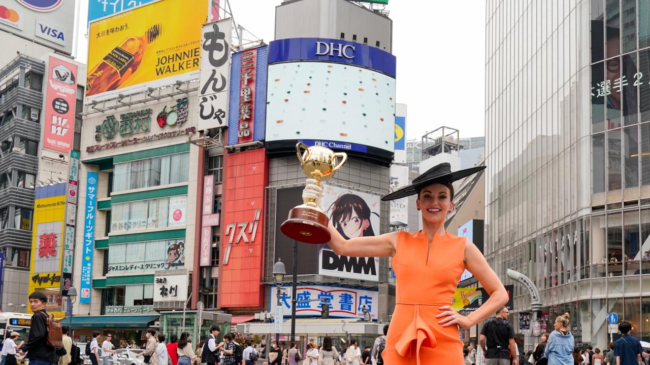 The Cup returns to Tokyo in 2024 after Bonnie Lane, above, wife of jockey Damian Lane, hit the famed Shibuya Crossing as part of the Lexus Melbourne Cup Tour's 2023 visit to Japan. Pic Getty Images