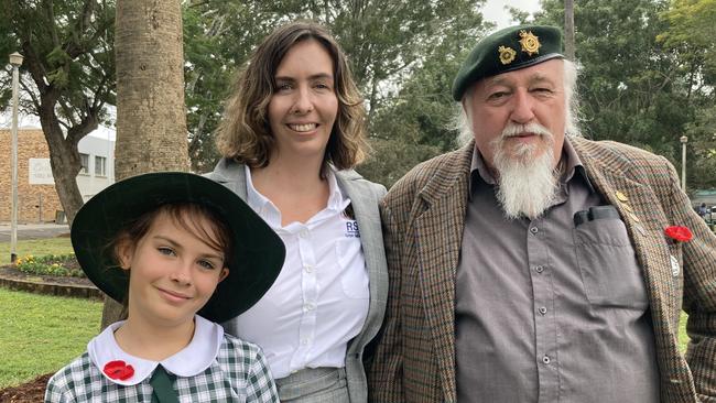 Gympie Anzac Day service 2022 - Isabella Deviney with Jessica and Graham Cross.