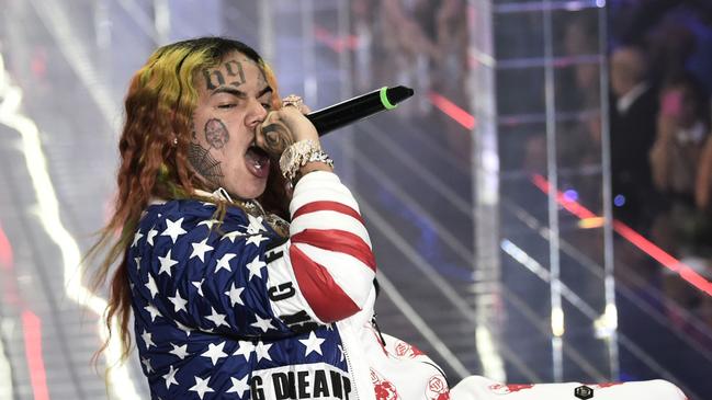 US rap singer 6ix9ine, or Tekashi 69, performs during the Philipp Plein fashion show as part of the Women's Spring/Summer 2019 fashion week in Milan. Photo: AFP