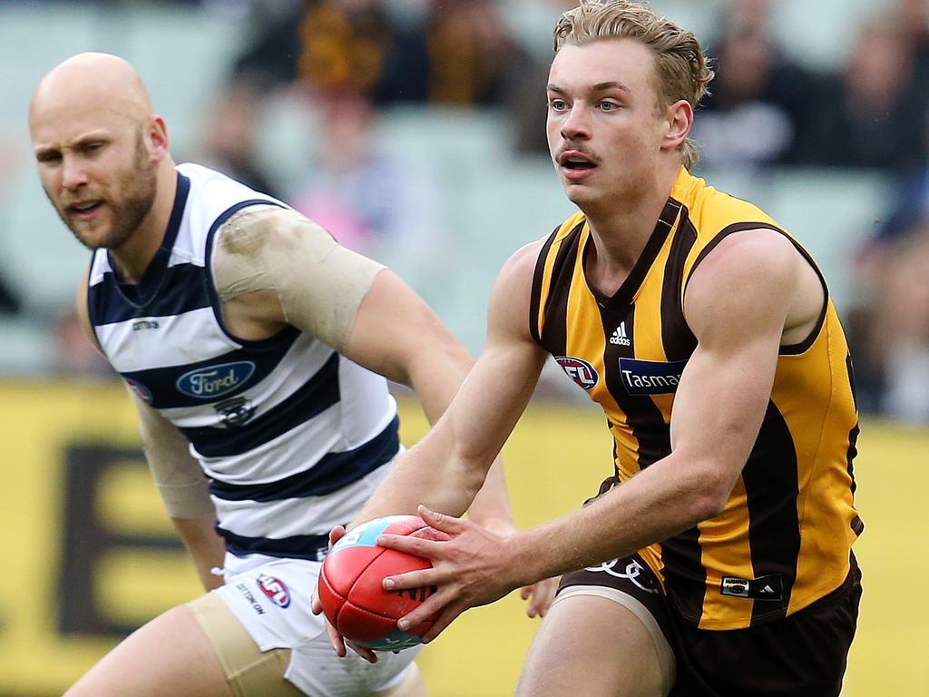 AFL Round 21. 11/08/2018.  Hawthorn v Geelong at the MCG.  Hawthorn's James Worpel skips away from Geelong's Gary Ablett   .Pic: Michael Klein