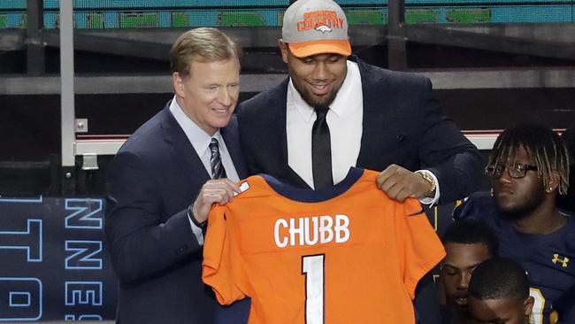 Commissioner Roger Goodell, left, presents North Carolina State's Bradley Chubb with his Denver Broncos jersey. Picture: AP.