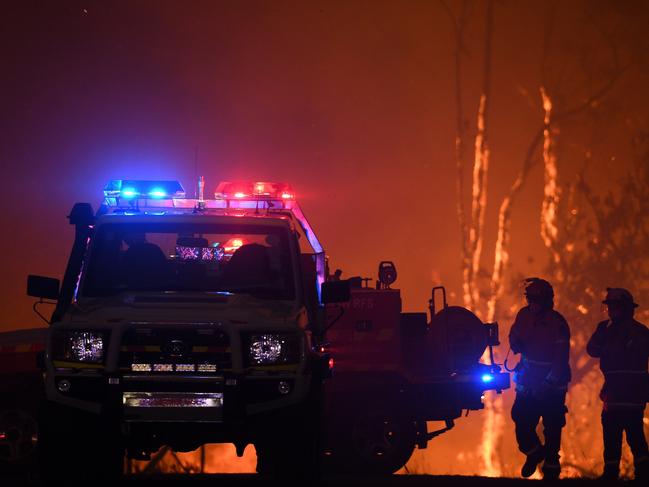 *This picture has been selected as one of the Best of the Year News images for 2019*NSW Rural Fire Service crews protect properties on Waratah Road and Kelyknack Road as the Wrights Creek fire approaches Mangrove Mountain north of Sydney, Thursday, December 5, 2019. (AAP Image/Dan Himbrechts) NO ARCHIVING