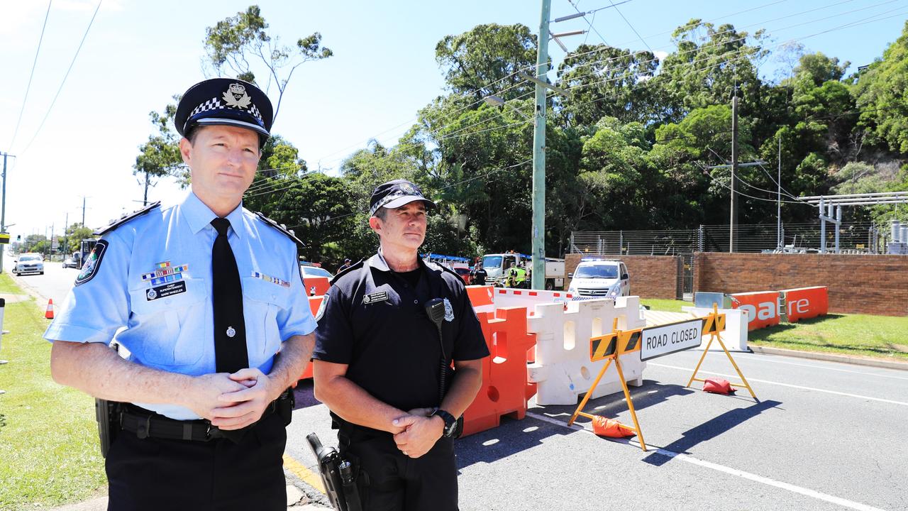 Queensland Police Deputy Commissioner Mark Wheeler and Senior Sergeant B Murphy inspect the new heavy concrete barriers. Photo: Scott Powick.