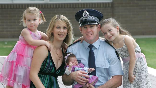 Former Brisbane Broncos hooker Michael Ryan with his family after graduating in 2010.