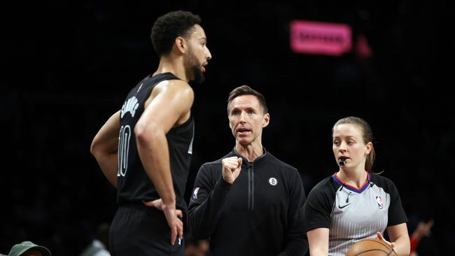 NEW YORK, NEW YORK - OCTOBER 21: Head coach Steve Nash talks with Ben Simmons #10 of the Brooklyn Nets as referee Dannica Mosher #89 looks on during the first half against the Toronto Raptors at Barclays Center on October 21, 2022 in the Brooklyn borough of New York City. NOTE TO USER: User expressly acknowledges and agrees that, by downloading and or using this photograph, User is consenting to the terms and conditions of the Getty Images License Agreement. (Photo by Sarah Stier/Getty Images)