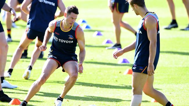 Sam Gibson, who won the 2km time trial on Monday, has impressed his new Crows teammates. Brodie Smith, who is back in running, watches on. Picture: AAP Image/Mark Brake