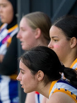 The Mt Gravatt-Jindalee girls bench in the under 17 SEQ AFL season.