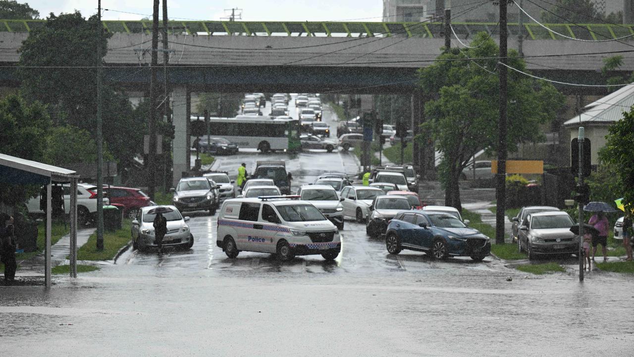 Cars stranded amid flash flooding at Stones Corner. Picture: Lyndon Mechielsen/Courier Mail