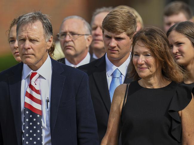 Fred and Cindy Warmbier watch as the casket for their son Otto is placed in a hearse after his funeral in Wyoming, Ohio. Picture: Photo/Bryan Woolston, File.