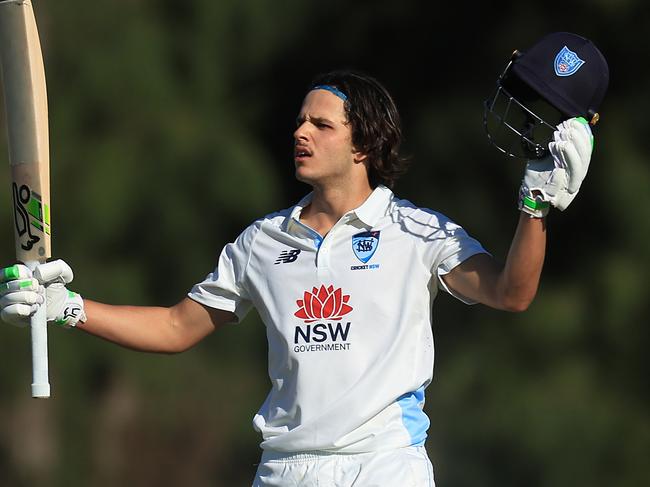 SYDNEY, AUSTRALIA - OCTOBER 10: Sam Konstas of the Blues raises his bat in the air after hitting a six to reach his century during the Sheffield Shield match between New South Wales and South Australia at Cricket Central, on October 10, 2024, in Sydney, Australia. (Photo by Mark Evans/Getty Images)