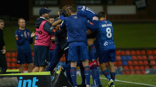 NEWCASTLE, AUSTRALIA – MARCH 23: Steven Ugarkovic of the Newcastle Jets celebrates his goal with teammates during the round 26 A-League match between the Newcastle Jets and Melbourne City at McDonald Jones Stadium on March 23, 2020 in Newcastle, Australia. (Photo by Ashley Feder/Getty Images)