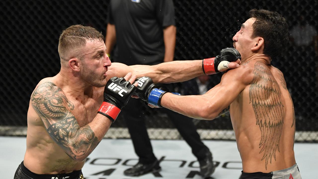 Alexander Volkanovski lands on Max Holloway at UFC 251. (Photo by Jeff Bottari/Zuffa LLC via Getty Images)