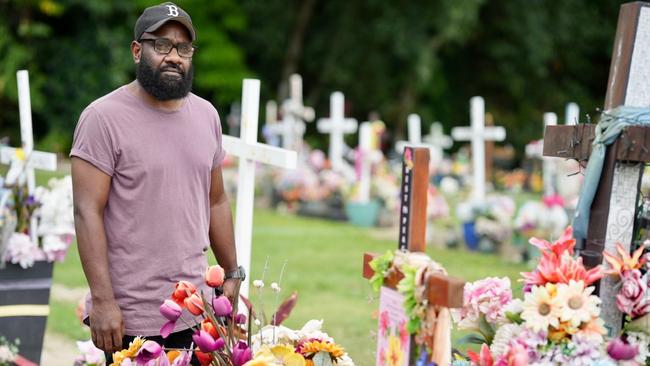 Bernard Namok at the Martyn St Cemetery after his relatives graves were desecrated by vandals on Tuesday night. Picture: Nuno Avendano