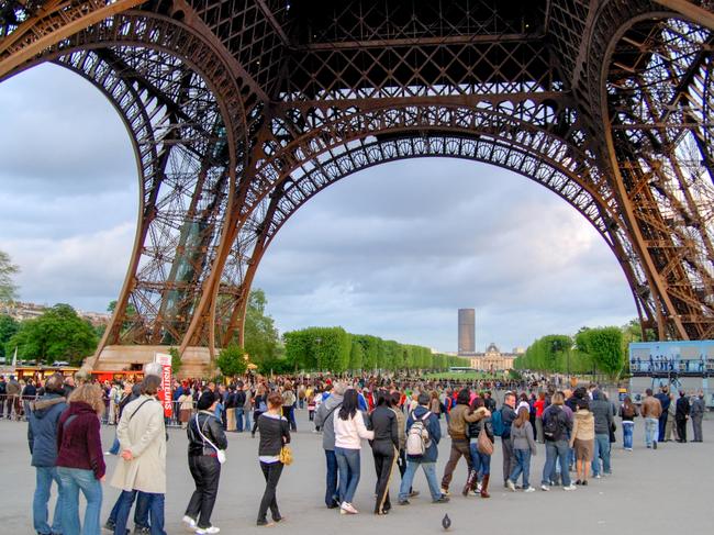 F95MBT People queuing to go up the Eiffel Tower, Paris.  Picture: Alamy