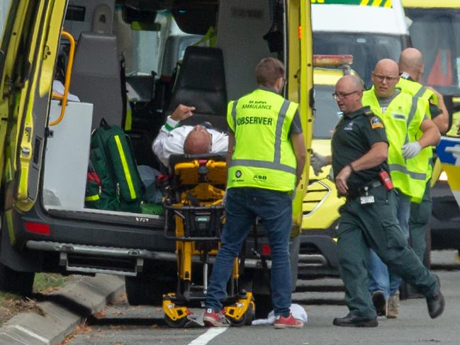 An injured person is loaded in an ambulance following a shooting at the Masjid Al Noor mosque in Christchurch, New Zealand, Friday, March 15, 2019. Multiple people have been killed after a gunman opened fire at two mosques in the New Zealand city of Christchurch. (AAP Image/SNPA, Martin Hunter) NO ARCHIVING