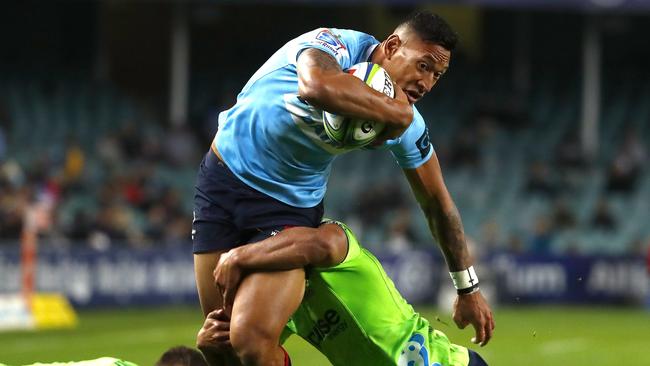 Israel Folau tries to bust through the Highlanders defence.