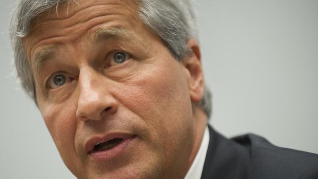 (FILES): This June 19, 2012 file photo shows JPMorgan Chase CEO Jamie Dimon testifying during a US House Financial Services Committee hearing on Capitol Hill in Washington, DC. Dimon announced July 1, 2014 that he was suffering from "treatable" throat cancer, and intends to retain his position as head of the bank during his recovery. "The good news is that the prognosis is excellent... my doctors said the cancer was discovered quickly and my illness is curable," said Mr. Dimon, 58, in a statement to employees and shareholders. AFP AFP PHOTO / Saul LOEB / Files
