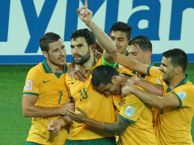 MELBOURNE, AUSTRALIA - JANUARY 09: Mile Jedinak of the Socceroos is congratulated by his teammates after scoring a goal during the 2015 Asian Cup match between the Australian Socceroos and Kuwait at AAMI Park on January 9, 2015 in Melbourne, Australia. (Photo by Scott Barbour/Getty Images)