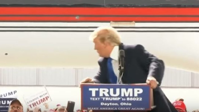 Flustered ... Donald Trump appeared visibly shaken as someone tried to rush the stage during a rally in Dayton, Ohio. Picture: YouTube