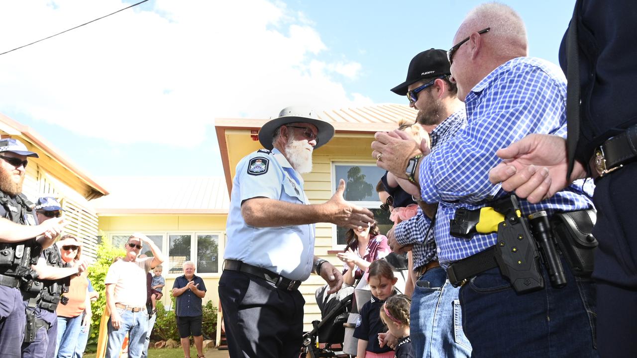 Final day: Sergeant Steve Ryan is farewelled by colleagues and members of the Millmerran community upon his retirement.