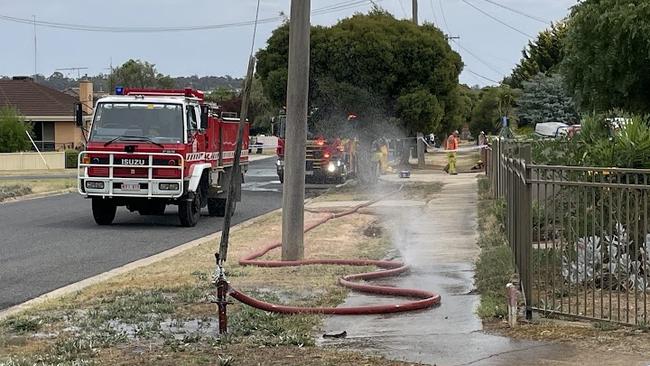 Emergency services at the scene of a house fire on Barr St in Maryborough on February 13, 2025. A baby was flown to hospital after the blaze.