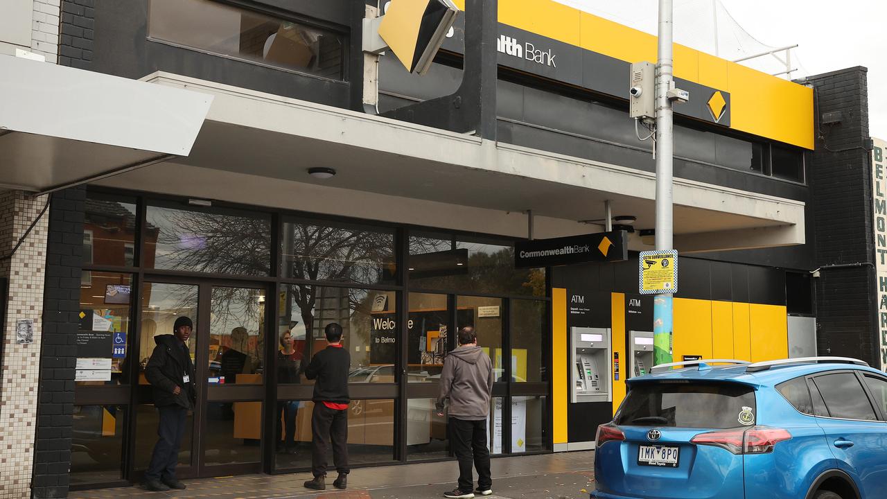 A security guard and waiting customers outside the Commonwealth Bank, High St Belmont. Picture: Alison Wynd