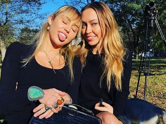 Miley and her sister Brandi pose at the wedding. Picture: Instagram