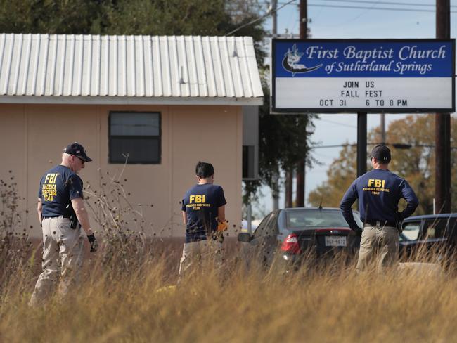 FBI agents comb the scene of a horrific mass shooting at the First Baptist Church, Sutherland Springs. Picture: Scott Olson/Getty Images/AFP