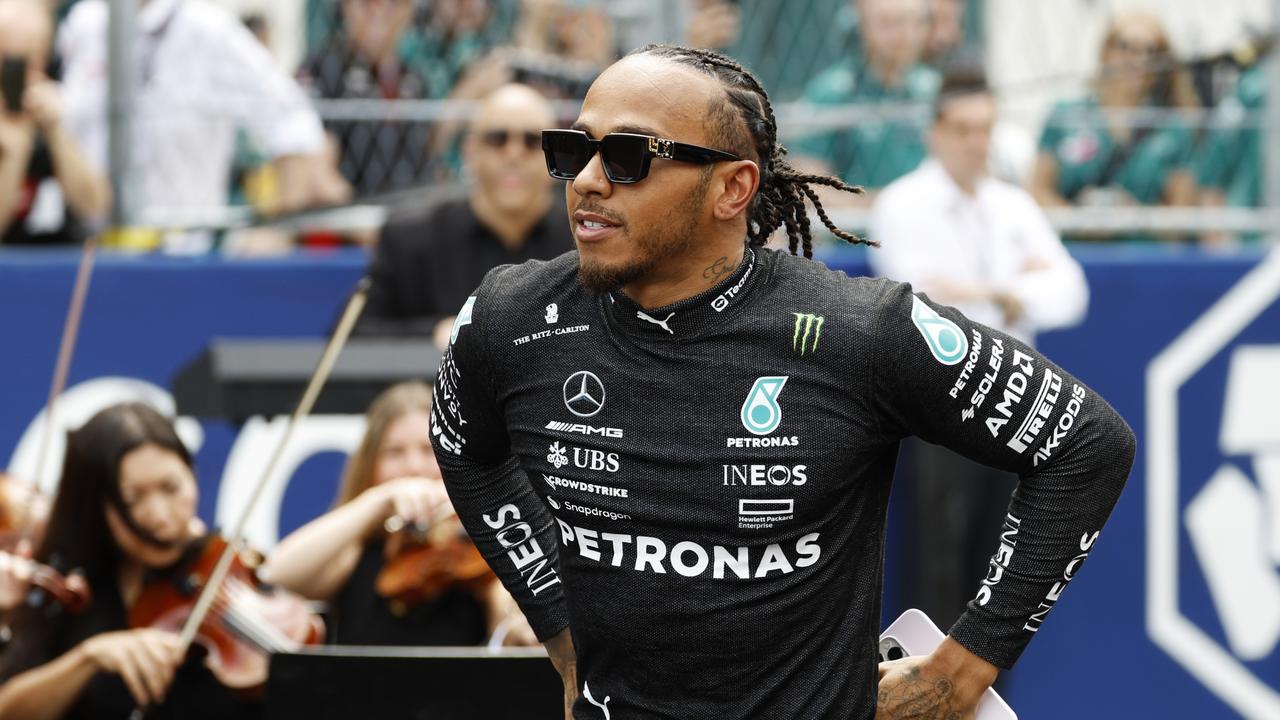 MIAMI, FLORIDA – MAY 07: Lewis Hamilton of Great Britain and Mercedes walks out onto the grid prior to the F1 Grand Prix of Miami at Miami International Autodrome on May 07, 2023 in Miami, Florida. (Photo by Chris Graythen/Getty Images)