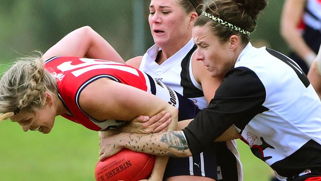 Darebin's Katie Brennan is tackled by two St Kilda opponents on Sunday. Picture: Carmelo Bazzano