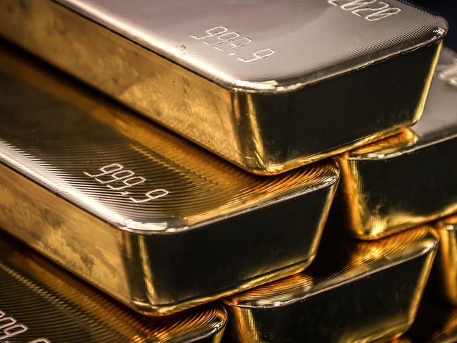 TOPSHOT - Gold bullion bars are pictured after being inspected and polished at the ABC Refinery in Sydney on August 5, 2020. - Gold prices hit 2,000 USD an ounce on markets for the first time on August 4, the latest surge in a commodity seen as a refuge amid economic uncertainty. (Photo by DAVID GRAY / AFP)