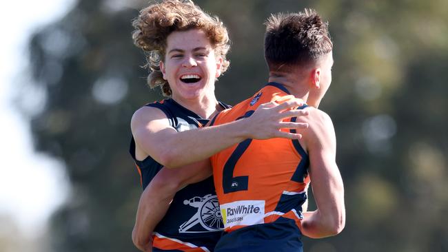Matt Weber celebrates his match-winning goal with Zac Taylor.