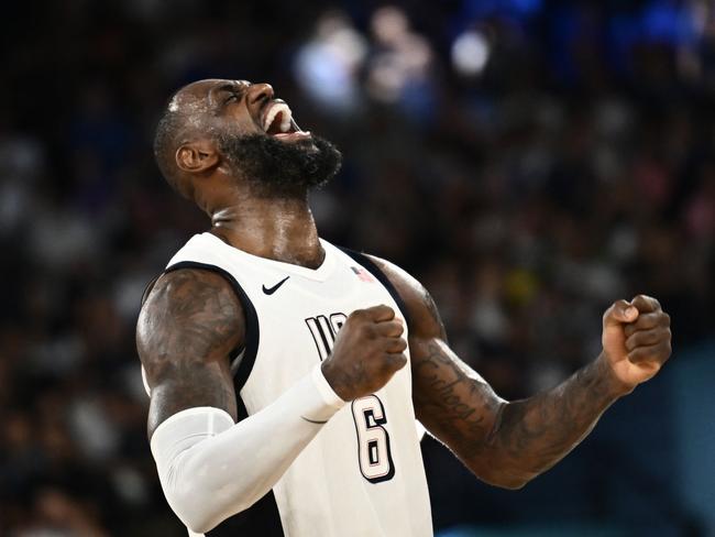 LeBron James lets out a roar after USA survived a huge scare against Serbia. Picture: Aris Messinis / AFP