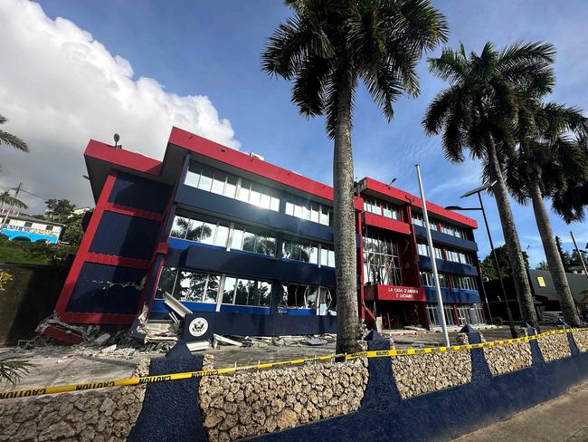 This handout photo taken and released on December 20, 2024 by the Australian Department of Foreign Affairs and Trade (DFAT) shows a general view of a severely damaged building housing the embassies of the United States, Britain, and New Zealand after a powerful earthquake struck Vanuatu's capital Port Vila on December 17. Rescuers say they have expanded a search for trapped survivors in quake-rocked Vanuatu to "numerous places of collapse" beyond the capital, as the death toll climbs to at least 10. (Photo by Handout / AUSTRALIAN DEPARTMENT OF FOREIGN AFFAIRS AND TRADE / AFP) / RESTRICTED TO EDITORIAL USE - MANDATORY CREDIT "AFP PHOTO / AUSTRALIAN DEPARTMENT OF FOREIGN AFFAIRS AND TRADE" - NO MARKETING NO ADVERTISING CAMPAIGNS - DISTRIBUTED AS A SERVICE TO CLIENTS