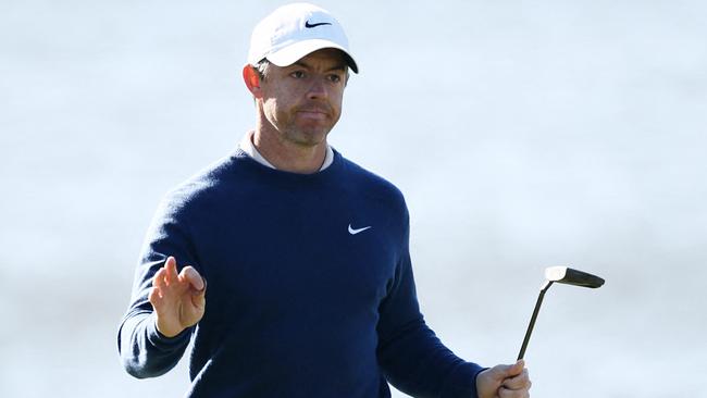 Rory McIlroy reacts on the 18th green during the playoff.