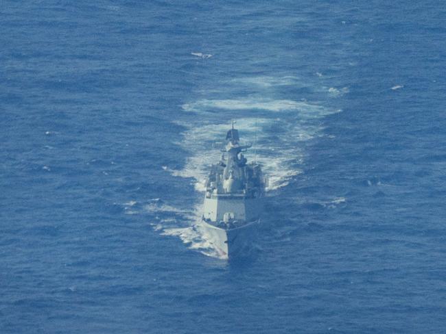 SCARBOROUGH SHOAL, SOUTH CHINA SEA - FEBRUARY 18: A Chinese Navy warship sails near the waters of Scarborough Shoal, as seen from aboard a Philippine Bureau of Fisheries and Aquatic Resources plane on February 18, 2025 in the South China Sea. A Chinese Navy helicopter nearly collided with a Philippine Bureau of Fisheries and Aquatic Resources plane in the latest flare-up of tensions between the two countries in the disputed waters. The incident occurred when the Chinese Navy deployed a helicopter to tail the Philippine civilian plane, which was conducting a routine maritime domain awareness flight over Scarborough Shoal, located within the Philippines' exclusive economic zone. (Photo by Ezra Acayan/Getty Images)