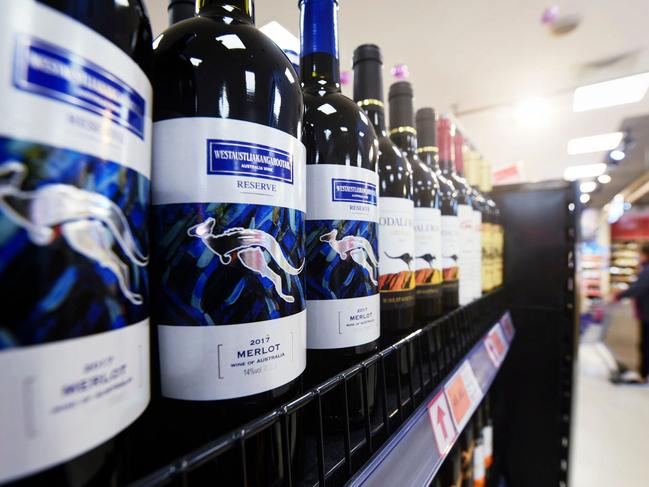 (FILES) This file photo taken on November 27, 2020 shows bottles of Australian wine at a supermarket in Hangzhou, in eastern China's Zhejiang province. - China on December 10, 2020 said it had imposed fresh import duties on Australian wine as it accused Canberra of giving firms subsidies, in the latest salvo in a bitter stand-off following last month's swingeing anti-dumping tariffs. (Photo by STR / AFP) / China OUT